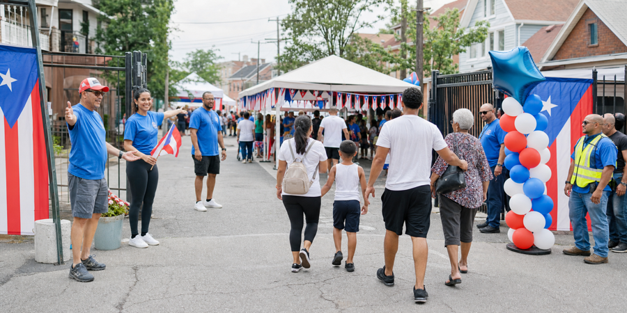 Families following signs and safety guidance at a Cleveland community event