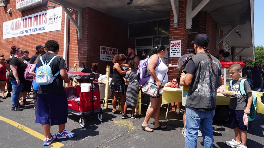 Families moving through the food and activity area