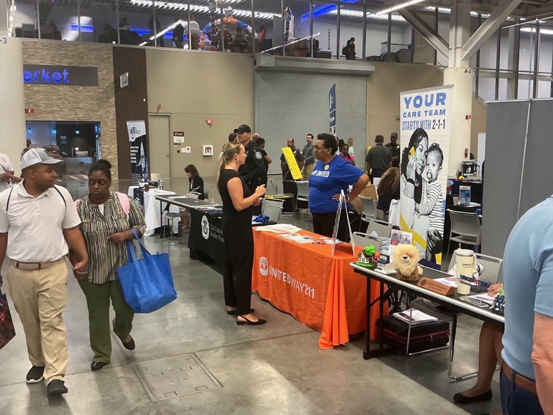 United Way 211 representatives speak with visitors at the Cleveland Success Fair.