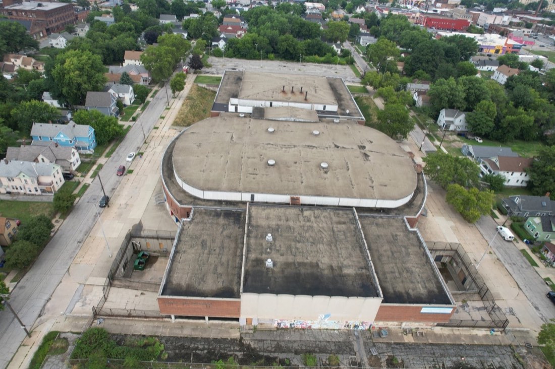 Overhead drone view of Lincoln-West High School’s rounded roof and front facade