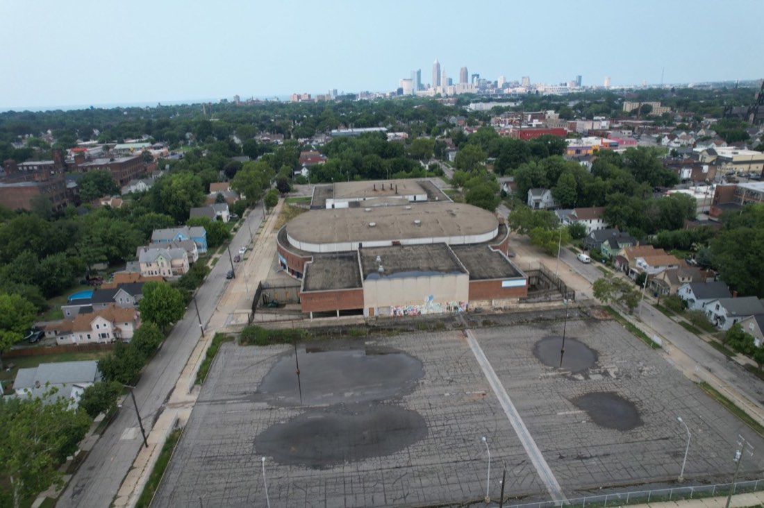 Front aerial view of the vacant Lincoln-West High School and its empty weathered parking lot