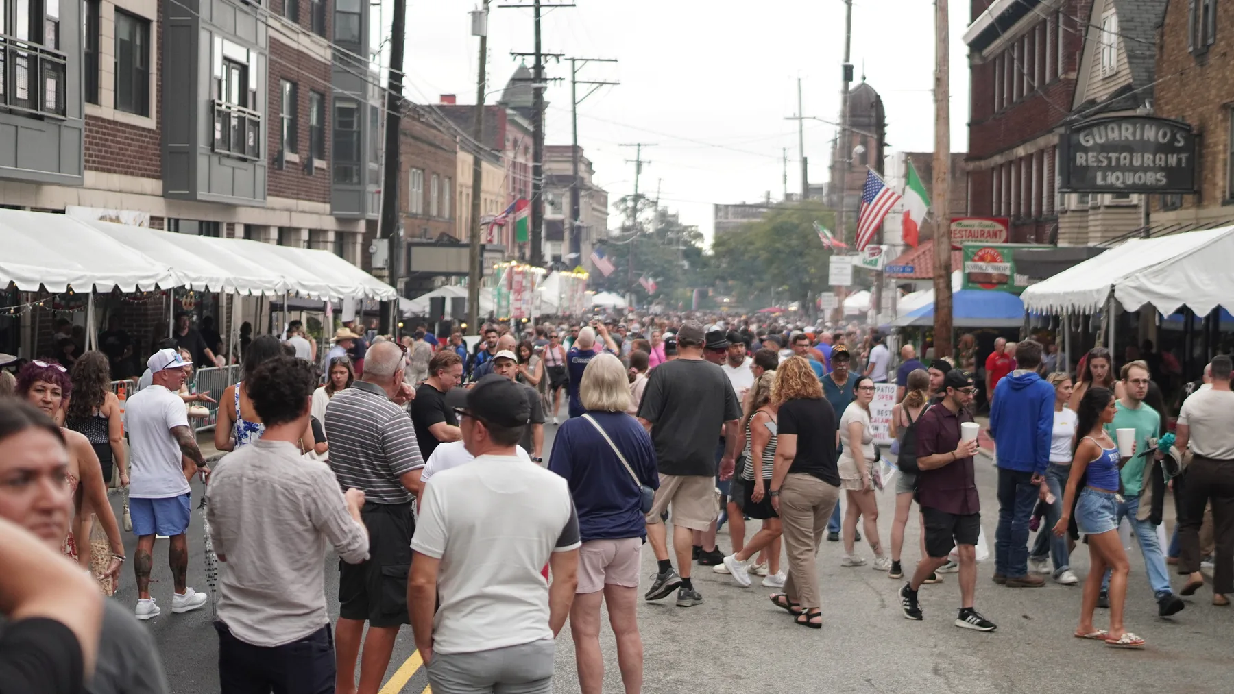 A large crowd walks through Cleveland Little Italy during the Feast.