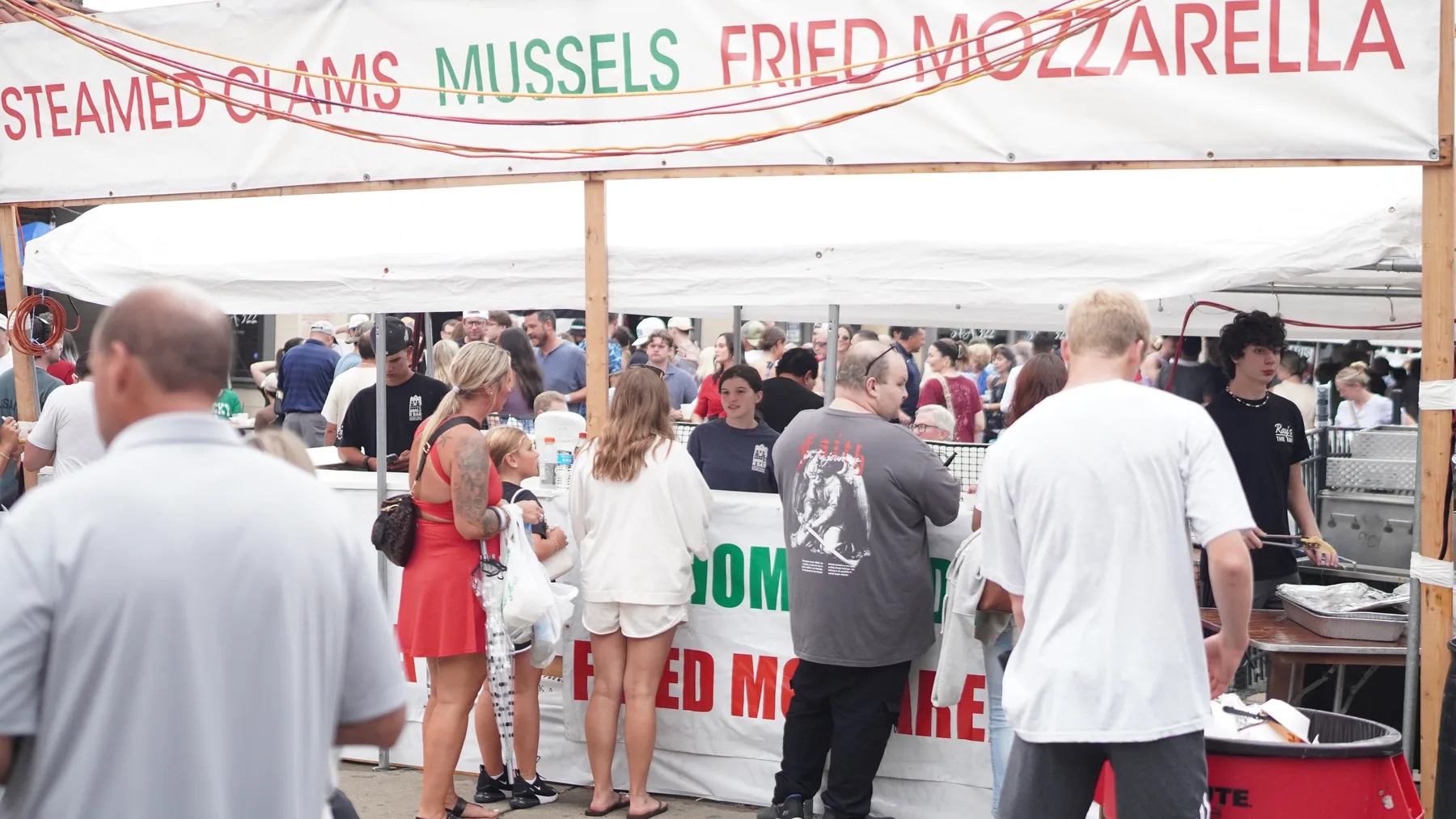 A busy tent serves clams, mussels and fried mozzarella.