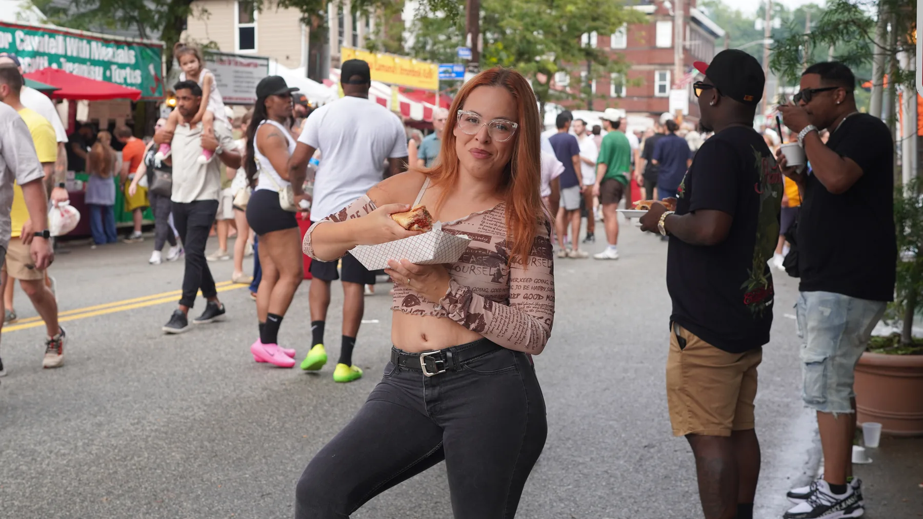 Jennifer Santana enjoying a meatball sub at the 2026 Cleveland Little Italy Feast