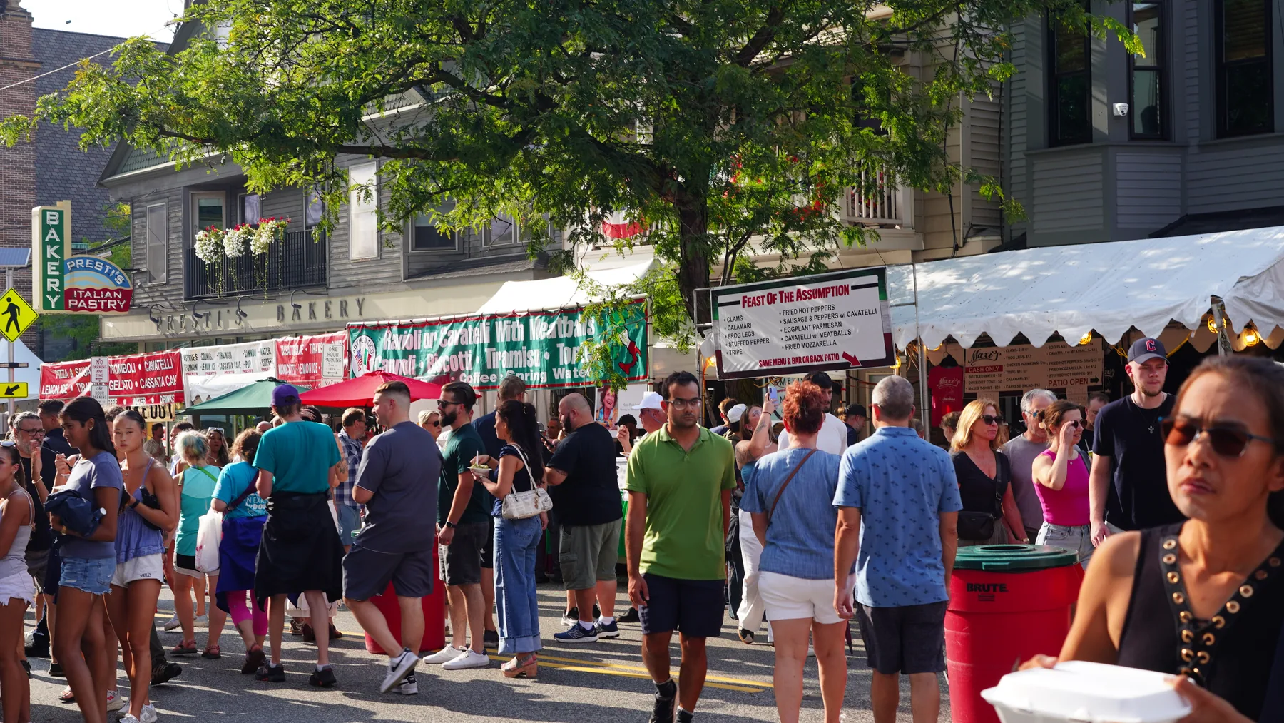 Sunny afternoon crowds gather near Presti’s Bakery and Feast food tents.