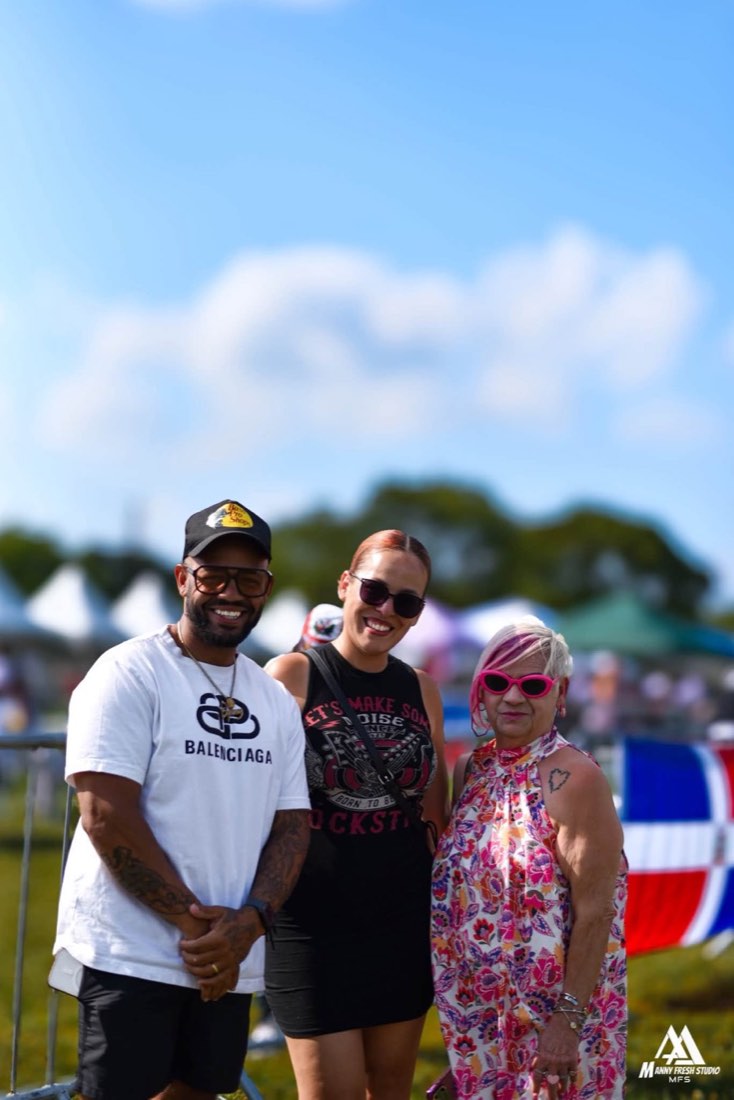 Three smiling festival attendees