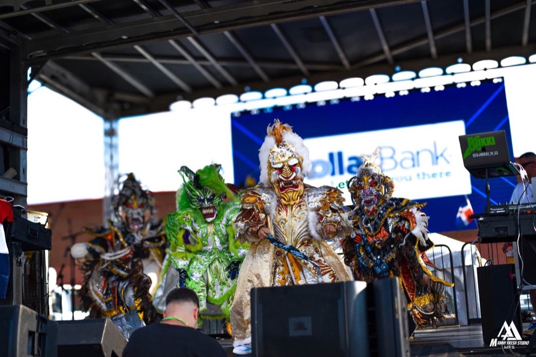 Costumed performers on the festival stage