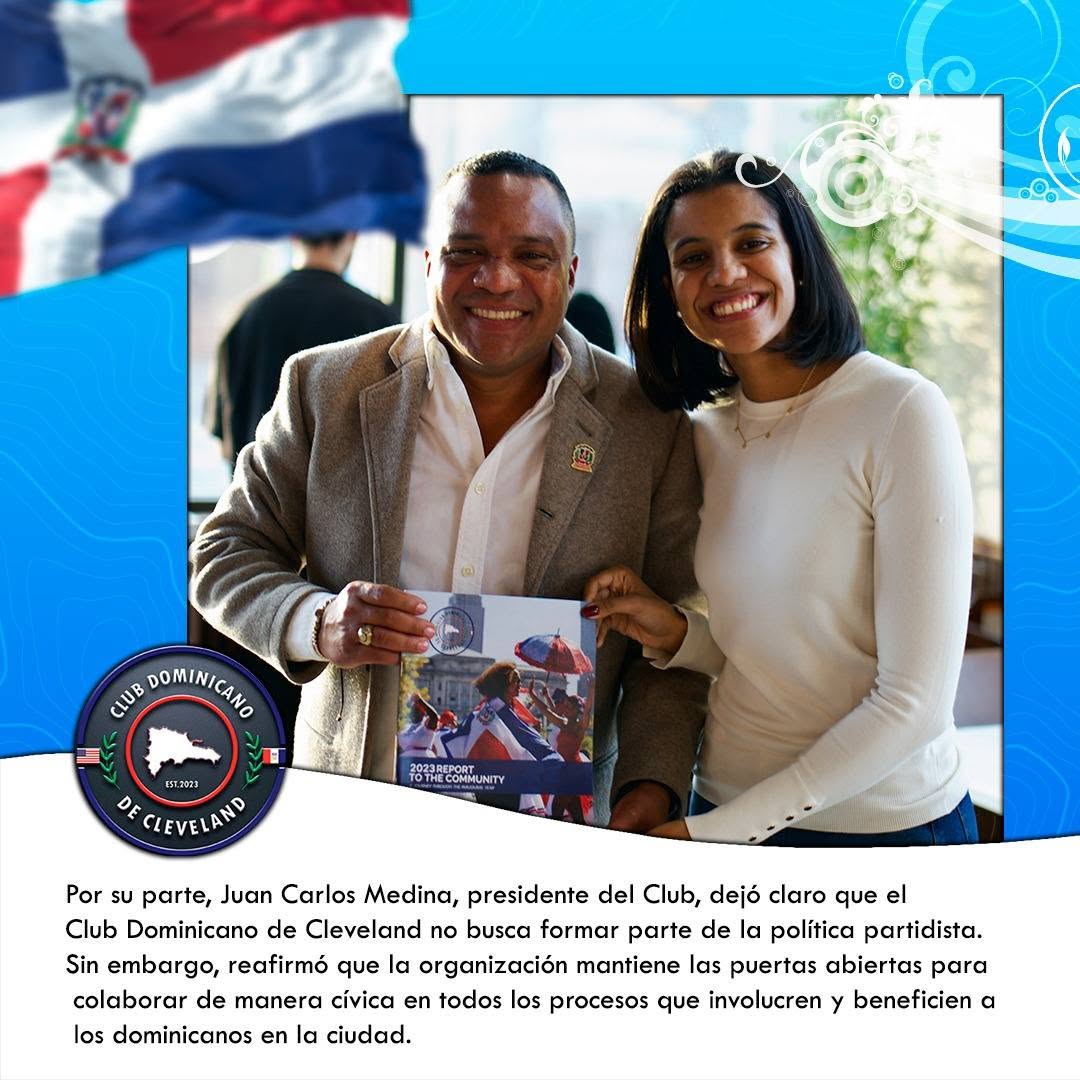 Club Dominicano de Cleveland President Juan Carlos Medina and a community partner hold a report.