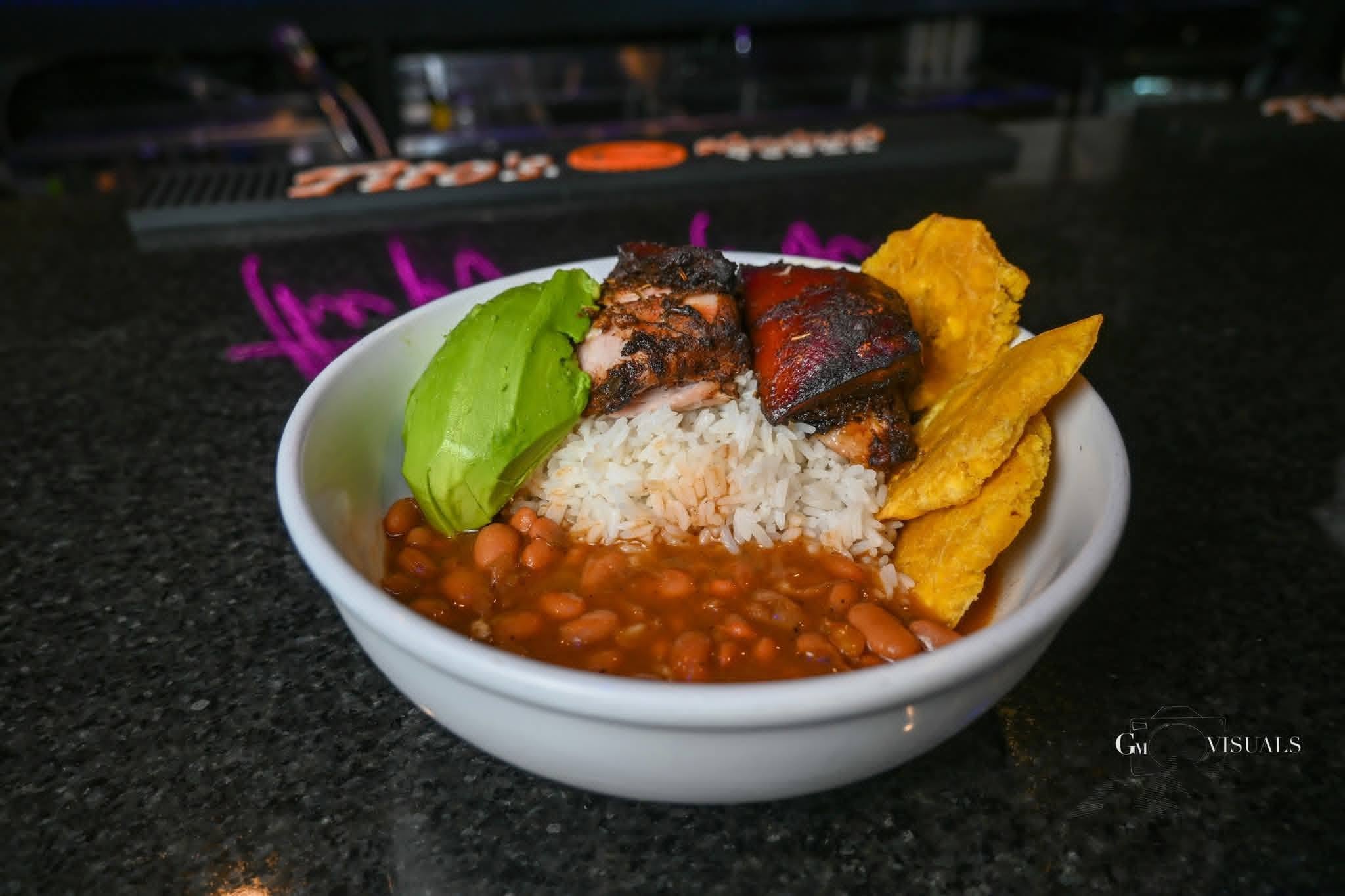 Rice, beans, meat, avocado and fried plantains served at Lucky’s
