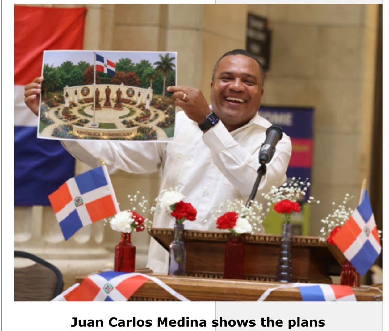 Club Dominicano de Cleveland President Juan Carlos Medina displays a rendering of the proposed Dominican cultural plaza at Cleveland City Hall.