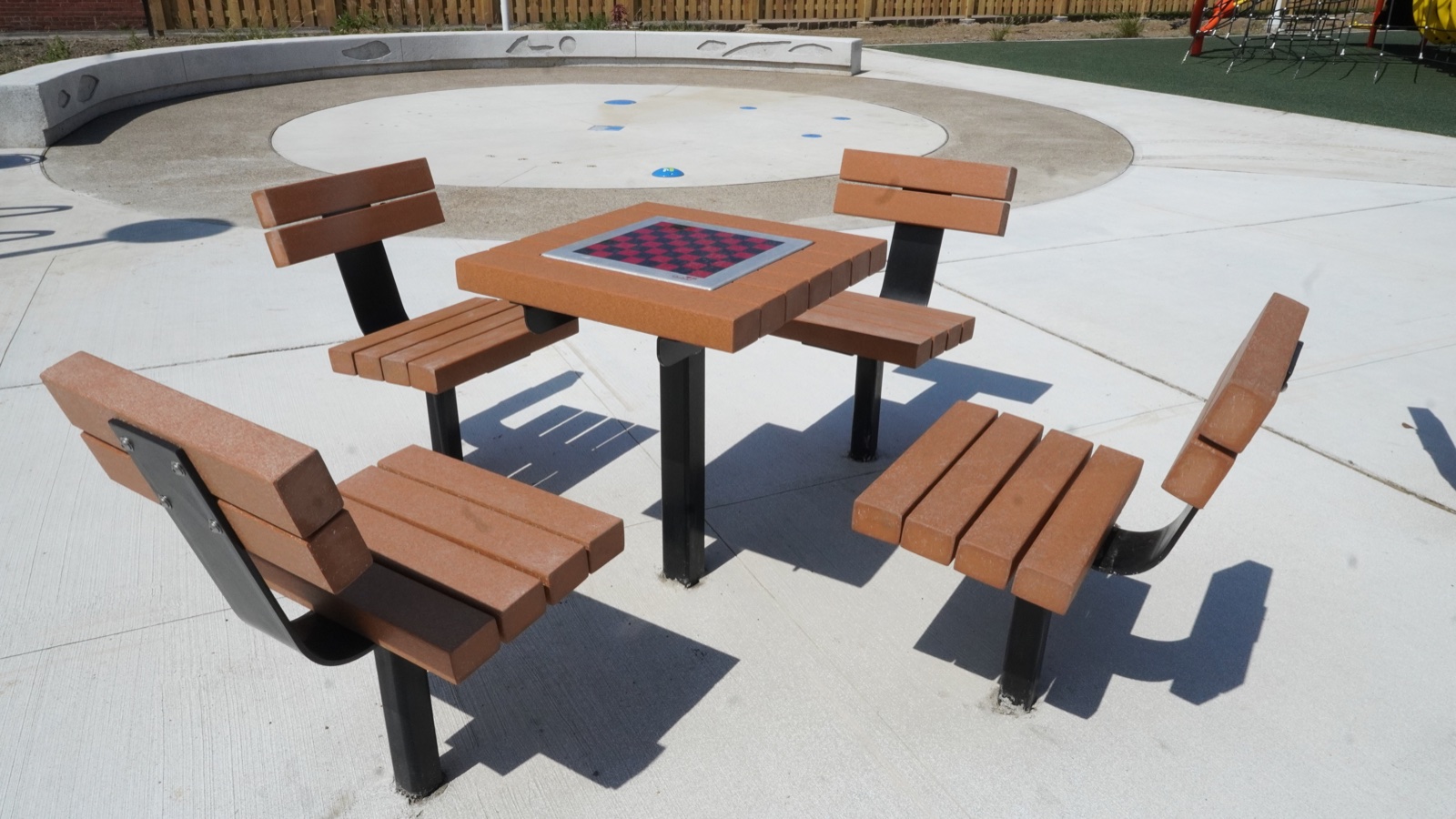 Outdoor game table and seating at Clark Recreation Center