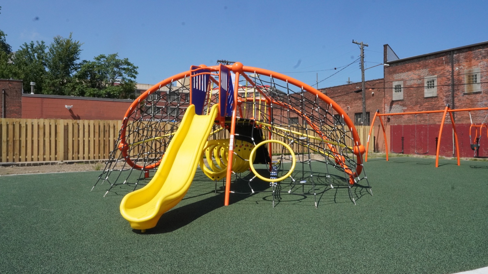 Orange and yellow climbing playground at Clark Recreation Center