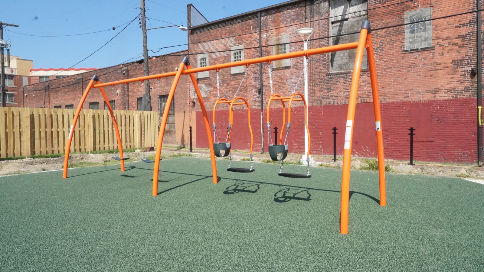 New orange swing set at Clark Recreation Center