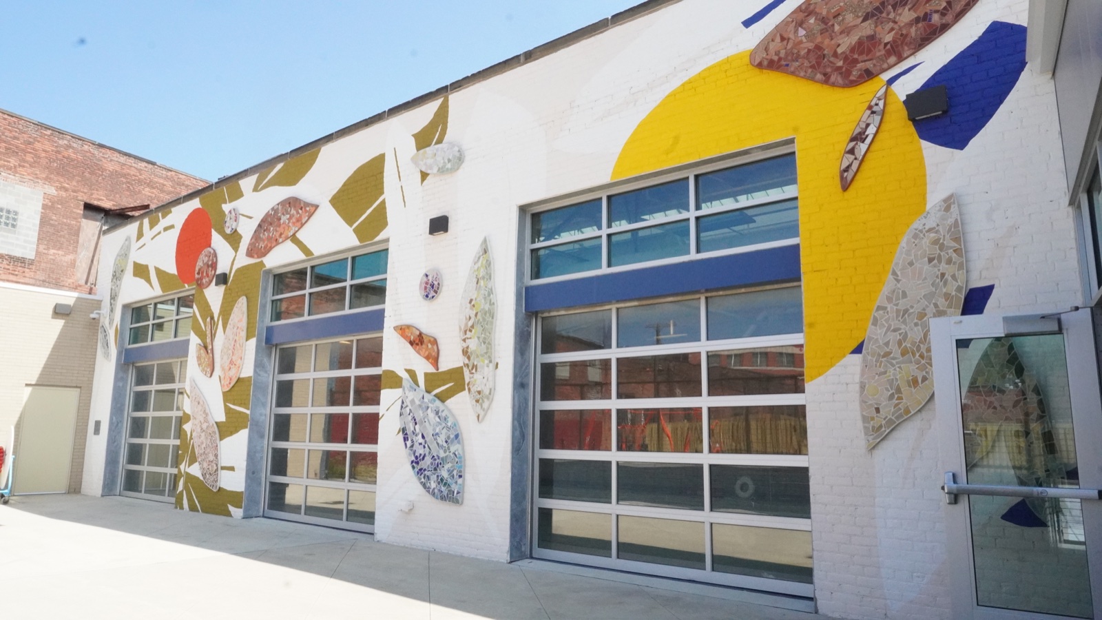 Colorful mosaic artwork and glass doors at Clark Recreation Center