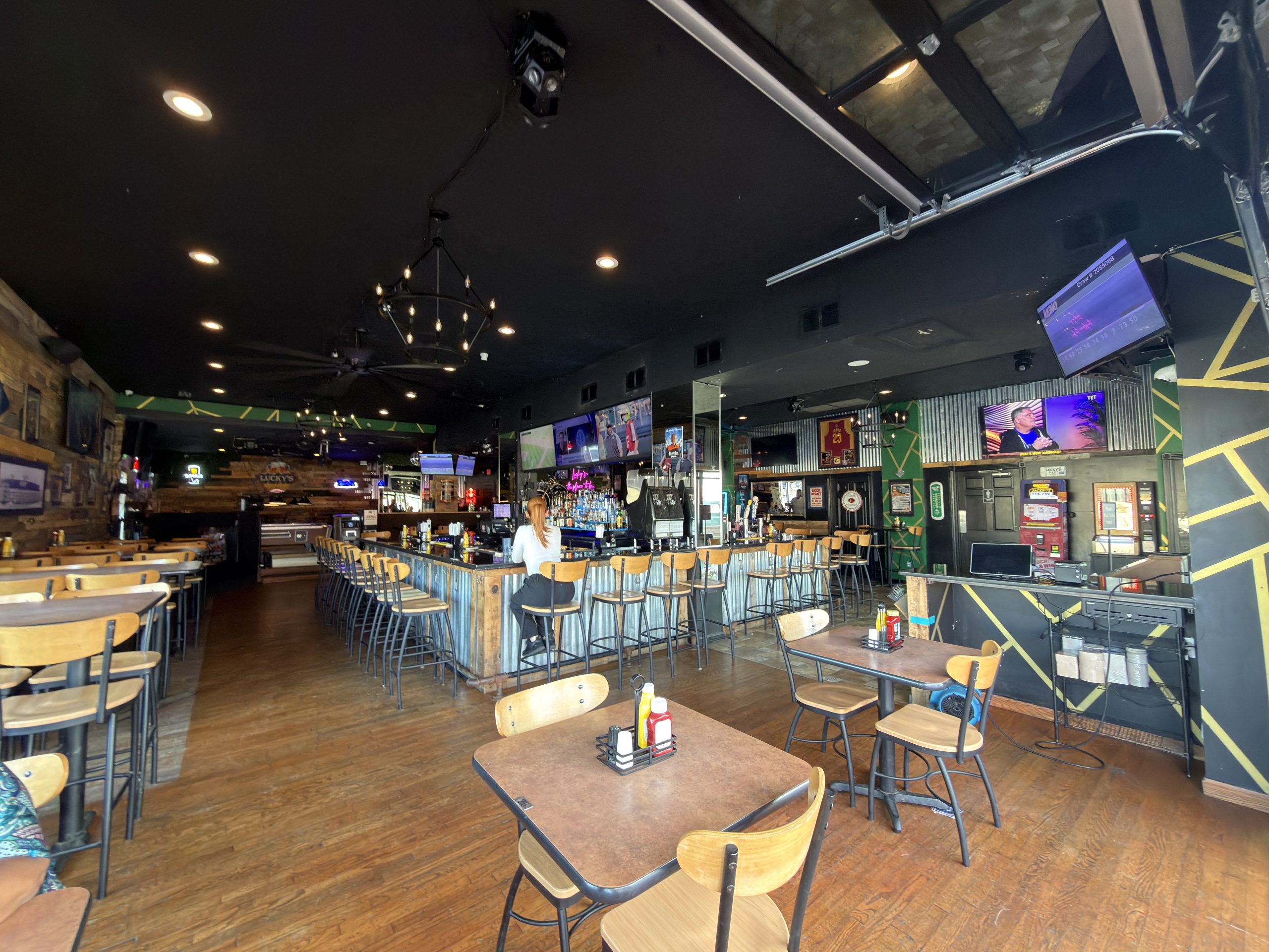 Interior dining room, pool tables and bar at Lucky’s Bar and Grill