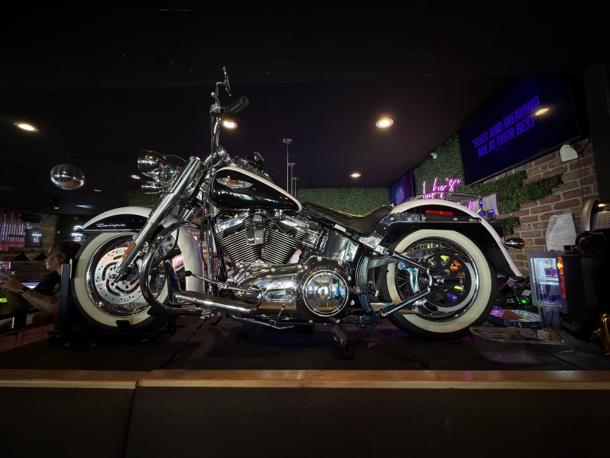 Full-size motorcycle displayed inside Lucky’s Bar and Grill