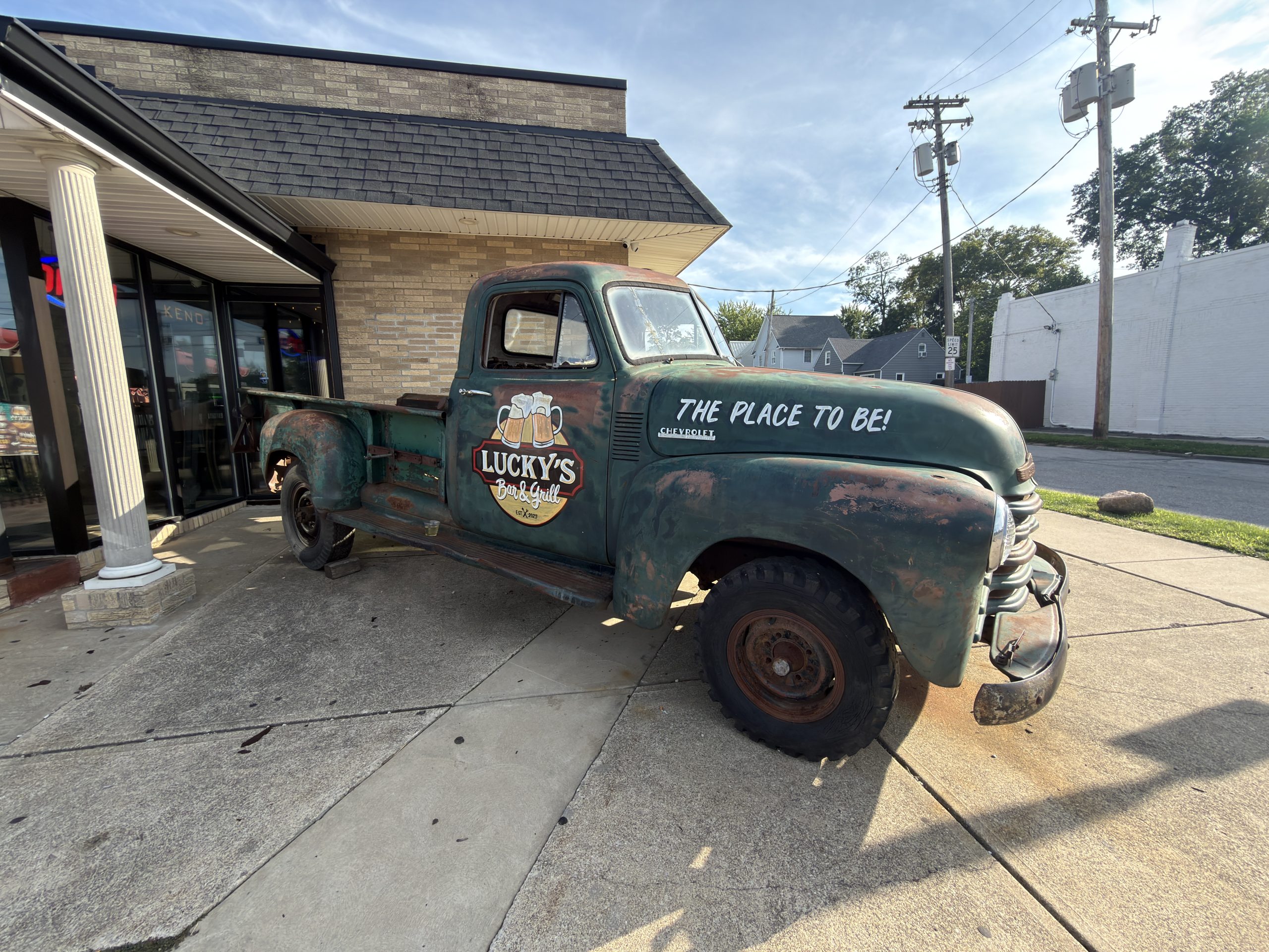 Vintage Chevrolet pickup displaying the Lucky’s Bar and Grill logo