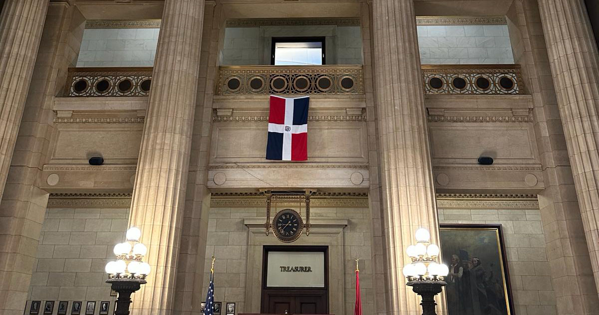 The Dominican Republic flag hangs inside Cleveland City Hall during a community ceremony.
