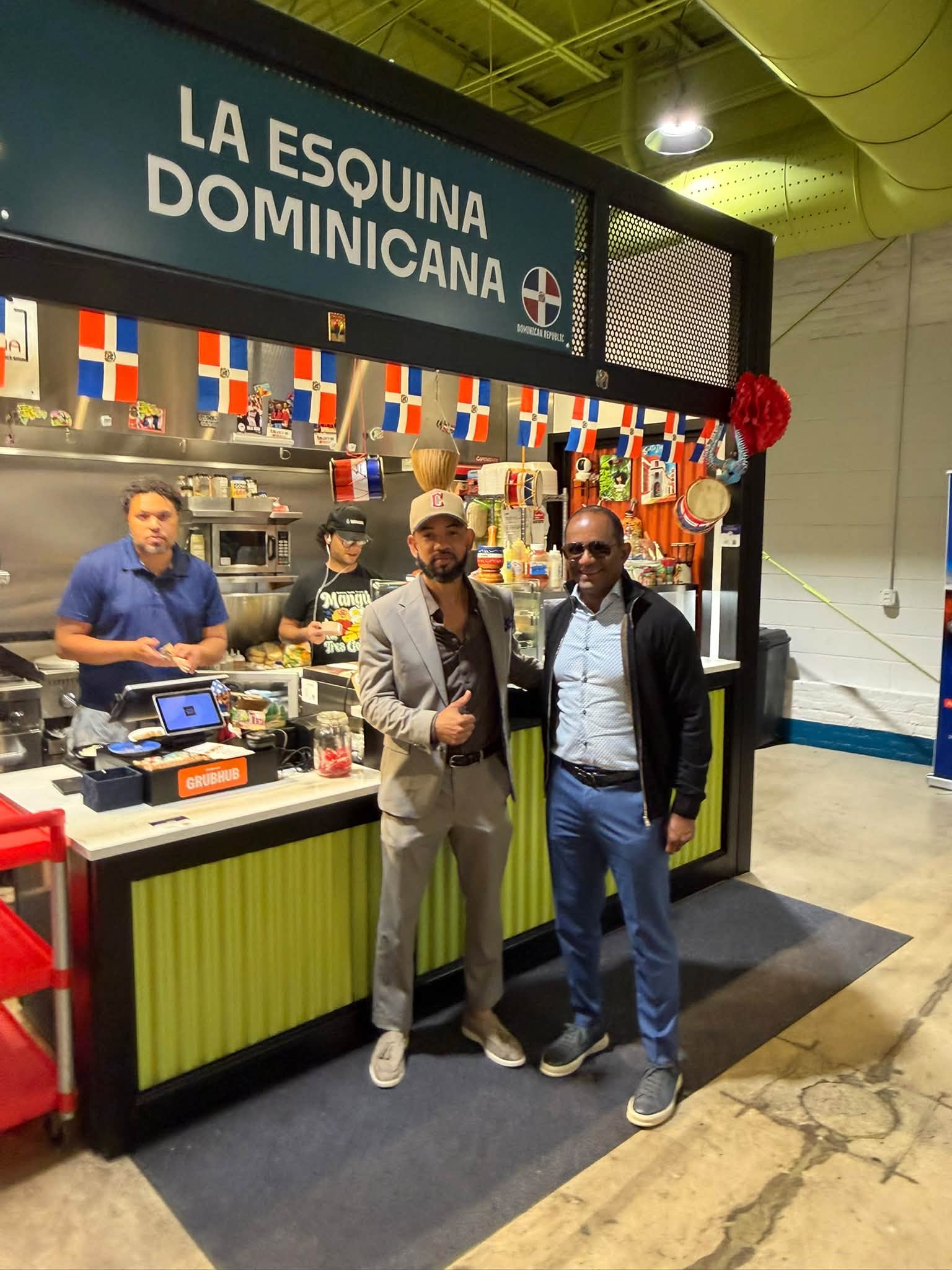 A photograph supplied for this article shows visitors and workers at La Esquina Dominicana inside CentroVilla25.