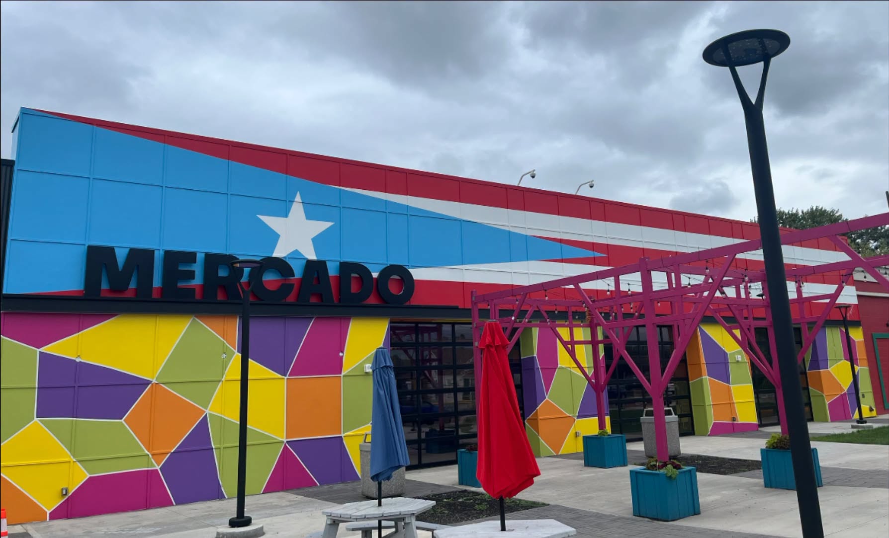 CentroVilla25’s colorful Mercado exterior and outdoor seating area.
